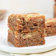 two pieces of cake sitting on top of a white plate