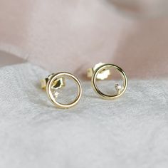 Circle stud earrings represent minimalist and elegant style. Delicate stud earrings are made for lovers of simple. Always remember that the simple things in life are often the most beautiful! Tiny diamond studs are made of solid 14K gold. Choose your colour of gold from the variations. DETAILED DESCRIPTION WiDTH                8mm METAL             Gold 14K WEIGHT                0,7g Diamond details Size - 2 x 1,25mm Carat weight - 0,015ct Handcrafted with love from our workshop in Prague.⚒ PACK Simple Things In Life, Circle Stud Earrings, Circle Earrings Studs, Tiny Stud Earrings, Tiny Diamond, Circle Studs, Solid Gold Rings, Always Remember, Diamond Studs