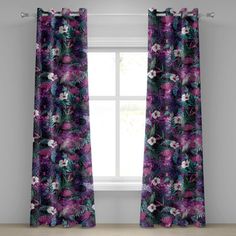 purple and green floral curtains hanging in front of a window