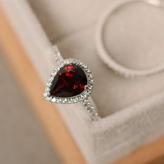 Garnet ring pear shaped engagement ring sterling silver | Etsy Formal Teardrop Ruby Ring, Formal Teardrop Ruby Ring Fine Jewelry, Teardrop Ruby Ring For Formal Occasions, Formal Teardrop Ruby Ring In Fine Jewelry Style, Pear-shaped Halo Jewelry As A Gift, Pear-shaped Halo Design Jewelry Gift, Elegant Pear Shaped Gemstone Rings, Fine Jewelry Pear-shaped With Halo Design, Formal Ruby Teardrop Ring