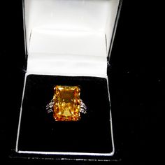 4.00ct Rectangular Octagonal Citrine Simulant Ring With 0.09ctw Round White Zircon Details At Sides. Solitaire Style. Prong Faceted. 18k Yellow Gold Over Sterling Silver. Size 7. Measures Approximately 3/4" Long And 1/2" Wide. Finished Under Gallery. New With Tags. Luxury Yellow Gemstones With Accent Stones, Luxury Yellow Diamond Gemstones, Elegant Yellow Sapphire Ring For Wedding, Formal Oval Yellow Topaz Ring, Formal Yellow Oval Topaz Ring, Elegant Octagon Citrine Rings, Elegant Yellow Sapphire Ring For Anniversary, Elegant Yellow Emerald-cut Diamond Ring, Elegant Yellow Emerald Cut Diamond Ring