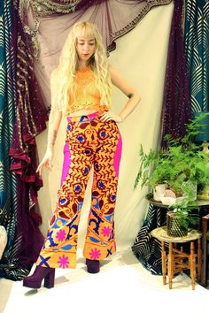 "Beautiful high waisted cotton flares made from handmade Indian Suzani embroidered fabric. The floral design has been hand stitched so each pair is totally unique. These 70's inspired trousers have a zip and hook fastening and feature back pockets. If you're looking for a retro and bohemian bold piece then look no further... Not only are they eye catching, but extremely comfortable. Please note: As each pair of flares is made completely from scratch the pair you receive may differ very slightly to the images above.  Model wears a size S, is a U.K 8-10 and 5'5\" tall :)  { Measurements }  XS Waist: 24\" Hips: 39\" Front Rise: 12\" Inside Leg: 31\" Full length: 42\" S Waist: 27\" Hips: 42\" Front Rise: 12\" Inside Leg: 31\" Full length: 42\" M Waist: 28\" Hips: 44\" Front Rise: Inside Leg: Vibrant Fitted Wide Leg Pants, Multicolor Cotton Flare Bottoms, Multicolor Flare Cotton Bottoms, Cotton Festival Bottoms, Cotton Flare Pants For Festivals, Festival Flare Cotton Pants, Multicolor Full Length Cotton Pants, Traditional Fitted Pants For Festivals, Fitted Cotton Bottoms For Festivals