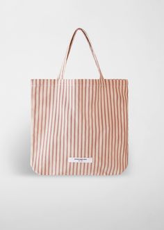 The Stripe Market Tote Bag is a practical accessory crafted from durable cotton canvas in NYC. Available in red and cream stripe or classic black and cream stripe, its compact size makes it perfect for everyday essentials, while sturdy handles ensure comfortable carrying. Everyday Striped Bag With Adjustable Strap, Striped Bag With Adjustable Strap For Everyday Use, Everyday Striped Rectangular Bags, Cotton Tote Bag With Striped Lining, Everyday Striped Canvas Bag, Beige Tote Shoulder Bag With Striped Lining, Rectangular Bags With Striped Lining For Daily Use, Everyday Tote Canvas Bag With Striped Lining, Tote Bags With Striped Lining For Everyday Use