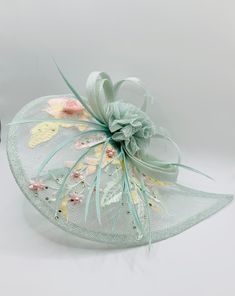 Stunning Mint Green Plink Wedding Fascinator Hat Duck Egg Blue Accents  Size 30.5 x 23cm head band or hair clip attachment  Perfect mother-of-the-bride wedding day accessory.   Elegant addition for those on the day essentials. matching Clutch Bag and Shoes available Green Headband Fascinator For Wedding, Green Handmade Flowers Wedding Fascinator, Elegant Green Hair Accessories For Wedding, Green Headband Mini Hat For Wedding, Green Wedding Headband Hair Accessory, Elegant Flower Headpieces For Gifts, Green Headband For Wedding, Elegant Party Headpiece With Flower Decoration, Elegant Hats With Handmade Flowers As Gift