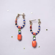 Statement Earrings, in Hot Orange and Blue, with a Hypoallergenic Stainless steel Stud post earring plated with a 18K gold. We use this material to ensuring your comfort and safety.  They were designed with natural Dalmatian Jasper, carefully selected Czech glass beads and  Crystal beads ,creating a unique combination.  Please note that the beads used in these earrings may vary slightly, adding to their unique charm.  ITEM DETAILS:  *Total length 45 mm from the post until the end of the pendant  *Earring post are lead and nickel free. I will prepare a pair of earrings for you, please note that they are made to order, and it could take a few days to process. They will came nice packaged in a Velvet Bag and a small Box, to protect them  during the shipment. Do you like them, but want to chec Trendy Colorful Beaded Hoop Earrings For Gifts, Colorful Beaded Dangle Earrings For Everyday, Trendy Orange Beaded Earrings For Gift, Everyday Multicolor Dangling Beads Earrings, Trendy Dangle Jewelry With Colorful Beads, Orange Hoop Earrings With Colorful Beads For Gift, Trendy Colorful Beads Dangle Jewelry, Trendy Small Hoop Earrings With Colorful Beads, Trendy Colorful Beaded Dangle Jewelry