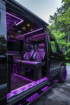 the interior of a black van with purple lights on it's doors and seats