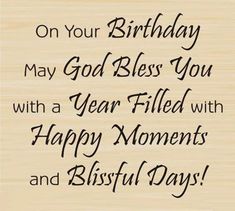 a wooden plaque with the words on your birthday may god bless you with a year filled with happy moments and blissful days