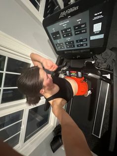 a man is doing exercises on an exercise machine