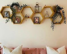 a living room filled with lots of furniture and decor on top of a white wall