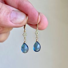 Blue Topaz Earrings, Dark Blue Teardrop Dangle Earrings, December Birthstone, Navy Drop Earrings Gold or Silver, Gemstone Gift for women  These precious delicate earrings feature dark blue topaz teardrops adorned with a white topaz connector in either gold filled or sterling silver. The earrings are suspended from lever back ear wires in the finish of your choice. These navy earrings are very feminine and a small pop of color for a blue loving girl. Ideal gift for a December birthday since this Sapphire Teardrop Jewelry With Gemstone Accents, Blue Gemstone Drop Earrings, Formal Gold Topaz Earrings, Formal Blue Topaz Drop Earrings, Blue Drop Earrings Pierced, Elegant Blue Teardrop Earrings With Lever Back, Sapphire Teardrop Earrings With Ear Wire, Sapphire Teardrop Gemstone Earrings, Teardrop Blue Topaz Earrings For Wedding