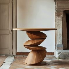 a wooden table sitting on top of a tiled floor