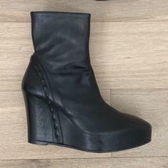 Ann Demeulemeester Black 125 Wedge Leather Ankle Boots With Stud Detail Size 41eu Retail $1340 Made In Italy Excellent Used Condition, Like New Comes With Original Box Black Leather 125mm Wedge Ankle Boots From Ann Demeulemeester Featuring Round Toe, Side Zip Fastening, Ankle-Length And High Wedge Heel. Unique Stud Detail Lining Heel These Black Ann Demeulemeester 125 Wedge Leather Ankle Boots Are Crafted In Italy With Almond Toes, Side Zip Fastenings And 125 Mm Wedge Heels. 5 Inch Heel With 1 Inch Platform Leather Wedge Boots With Sculpted Heel And Round Toe, Chic Leather Wedge Heeled Boots, Black Leather Wedge Boots With Sculpted Heel, Leather Wedge Boots With Pointed Toe For Evening, Formal Leather Wedge Boots With Reinforced Heel, Modern Wedge Heel Boots For Formal Occasions, Formal Wedge Heel Platform Boots, Elegant Evening Wedge Boots, Leather High Heel Wedge Boots For Evening