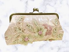 Check out this GORGEOUS clutch from our seller JPE Finery!__ While this purse would be perfect for any special occasion, we think it would especially suit a bride with a blush wedding gown or her maid of honor!__ This handmade clutch was crafted in the state of Washington. __ #handmadeclutch #pinkclutch #floralclutch #handmadefloralclutch #MyCommunityMade #handmadegifts #shopsmallbusiness #etsyalternative #maidofhonorgifts #maidofhonorgift #maidofhonorpurse #weddingpurse #weddingclutch Elegant Beige Clutch As Gift, Handmade Chic Clutch Evening Bag, Chic Handmade Clutch Evening Bag, Elegant Beige Clutch For Gift, Elegant Pink Evening Bag Gift, Elegant Pink Evening Bag As Gift, Beige Envelope Clutch For Evening, Beige Clutch Evening Bag For Wedding Guest, Elegant Beige Evening Bag For Gift