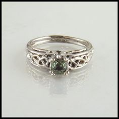 Celtic Cathedral Ring in White Gold with Green Sapphire Wedding Rings Sage Green, Sage Green Wedding Rings, Sage Wedding Ring, Silver And Green Wedding Ring, Green Wedding Ring Silver, Nontraditional Engagement Rings Silver, Sage Green Wedding Ring, Unique Stone Engagement Rings, Swaggy Jewelry