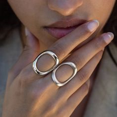 Expertly crafted in sterling silver, this wearable work of art is an emboldened version of our signature piece, the perennially popular Continuity Ring. We gave this juicier version just enough self-assured heft to take things up a notch for those who believe more is more. As with most of our pieces, this ring is designed for daily wear, so it's a super comfortable symbol of the power of perseverance and the continuous cycle of life. ◆ Made to order ◆ Approximately 28mm tall, 2mm thick ◆ Solid S Fine Jewelry Sterling Silver Dome Ring In White Gold, White Gold Sterling Silver Dome Ring, Timeless White Gold Sterling Silver Dome Ring, Elegant Wide Band Metal Ring, Timeless White Gold Dome Ring In Sterling Silver, Fine Jewelry White Gold Dome Ring, Fine Jewelry White Gold Dome Ring With Open Design, Sterling Silver Dome Ring With Polished Finish, Sterling Silver Dome Ring With Open Band