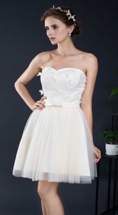 Elegant Cream Tutu Dress For Wedding, Sleeveless Tutu Dress With Fitted Bodice For Wedding, Cream Tulle Wedding Dress For Debutante Ball, Spring Wedding Tutu Dress With Lace Bodice, Cream Tulle Skirt Dress For Bridesmaid, Fitted Sleeveless Tutu Dress For Wedding, Cream Tulle Bridesmaid Tutu Dress, Cream Strapless Dress For Wedding, Cream Tulle Tutu Bridesmaid Dress