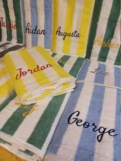 towels with names on them sitting on a table