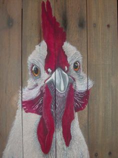 a painting of a rooster on a wooden fence with wood planks in the background