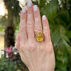 This exceptional Tiffany & Co. Jean Schlumberger ring features a rare, GIA-certified, no-heat yellow sapphire weighing an impressive 16.13 carats. The oval-cut sapphire, with its vibrant, sunny hue, measures approximately 20 x 25 mm across the top, creating a bold and elegant centerpiece. Crafted in 18-karat yellow gold, the ring showcases Schlumberger’s iconic design, blending timeless sophistication with unique artistry. Signed “Tiffany & Co.” and “Schlumberger,” this piece reflects the unparalleled craftsmanship and distinctive aesthetic of the famed jeweler, making it a coveted item for collectors and connoisseurs alike. Size 7 (can be sized), this ring is a stunning statement of luxury and refinement. Weight: 10 grams. Schlumberger Ring, Jean Schlumberger, Elegant Centerpiece, Elegant Centerpieces, No Heat, Iconic Design, Yellow Sapphire, Tiffany & Co., Oval Cut