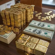 stacks of money and gold coins on a table