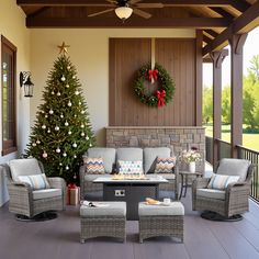 a decorated porch with christmas tree and furniture