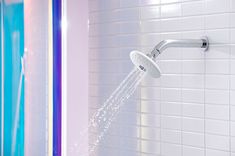 a shower head with water coming out of it