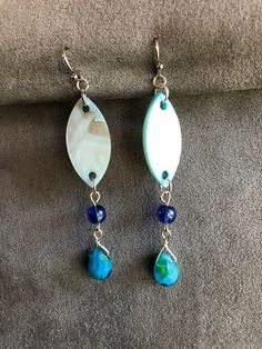 Light and swinging these blue dangles have a sheen of mother of pearl. With glass bead accents complimenting the pointed oval, these will have people turning to look. The colors of the ocean flow into your hair and show off your style. Wear them at the beach, the pier, pool or to your dinner date. Fun gift for a friend, teacher or yourself. Blue Bohemian Pearl Drop Earrings, Blue Pearl Drop Bohemian Earrings, Adjustable Blue Teardrop Dangle Earrings, Blue Bohemian Drop Earrings, Blue Dangling Beads Teardrop Earrings, Bohemian Blue Drop Earrings, Blue Dangle Earrings, Etsy Earrings Dangle, Ocean Blue