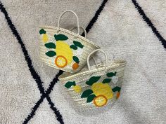 Prepare for summer with our lively Summer Lemon Bag. This beach tote features hand-embroidered lemons on a straw base, infusing your holiday wardrobe with a hint of Italian elegance. Crafted from premium-quality straw, the Lemon Beach Bag is both stylish and functional, perfect for carrying all your beach or poolside necessities. Its roomy interior offers plenty of space for towels, sunscreen, snacks, and more, making it the ideal summer tote. Our Italy Inspired Tote. The lemon embroidery brings Lemon Embroidery, Lemon Bag, Prepare For Summer, Large Weekender Bag, Italian Elegance, Summer Shopping, Summer Tote, Bag Summer, Holiday Wardrobe