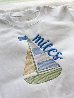 Sweet sailing with this classic sailboat shirt! This style features both a boy and girl color scheme. You may also inquire about a different color combination that you desire! These shirts and blanks are high quality 100% combed cotton. Please select shirt size and style. Please add the NAME you would like in the NOTES TO SELLER box. If you do not want a name, type NO NAME. ALSO- please put BOY OR GIRL COLOR SCHEME!  You may add additional notes there as well!  Please message me with any questio Boat Embroidery, Boat Birthday, Kids Boat, Patchwork Tee, Classic Sailboat, Boat Shirts, Towel Embroidery, Embroidery Shirt, Embroidery Tshirt