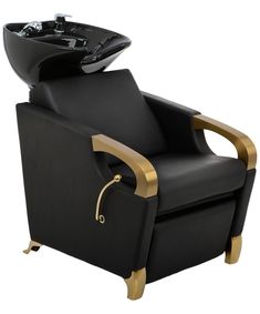 a black and gold reclining chair with a bowl on it's back end