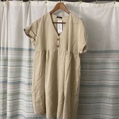 Reposhing This Item I Just Purchased Because It Didn’t Fit Me Right In The Chest Area. It’s Not A Full Empire Waist Top And Cuts Off On A Weird Place If You’re Full Chested. Cute, Cuffed Sleeves And A Nice Linen Material. Casual Khaki Midi Dress For Daywear, Casual Khaki Linen Dress, Casual Khaki Dress For Vacation, Casual Khaki Beach Dress, Beige Relaxed Fit Midi Dress For Vacation, Casual Neutral Midi Dress For Vacation, Neutral Short Sleeve Midi Dress For Beach, Beige Tunic Midi Dress For Daywear, Sparkly Short Dress