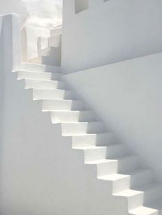 white stairs leading up to the top of a building