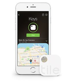 an iphone with a map on the screen and a key finder next to it