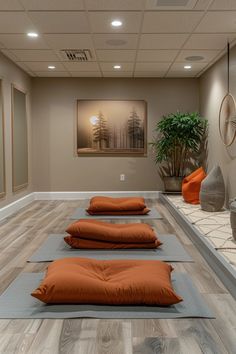 yoga mats lined up on the floor in an empty room