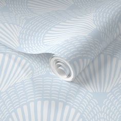 a blue and white wallpaper with an abstract design