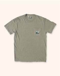 Original design embroidered on a 4" x 4.5" pocket. Perfect for couples or for those who simply love the mountains. T-shirt color is khaki green. T Shirt With Pocket Design, Casual Khaki T-shirt For Outdoor, Cotton T-shirt With Pockets For Outdoor, Green T-shirt With Pockets In Relaxed Fit, Green Relaxed Fit T-shirt With Pockets, Green Casual T-shirt For Adventure, Outdoor Relaxed Fit T-shirt With Pockets, Summer Outdoor T-shirt With Pockets, Khaki Crew Neck T-shirt With Pockets