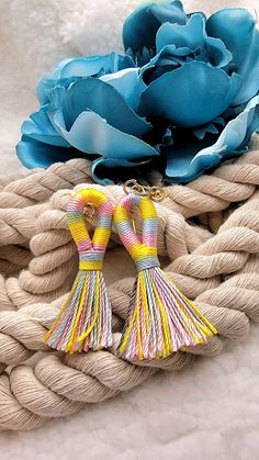 "✨️FREE SHIPPING (USPS First-Class Mail) and will ship out in ONE Business Day ✨️ \"Vibrant Striped Tassel Earrings: A Spring/Summer Symphony of Color\" Step into the bright side of fashion with our Vibrant Striped Tassel Earrings, tailored perfectly for the Spring and Summer seasons. Swirling in a harmonious yellow, blue, and pink blend, each tassel tells a story of vibrant sunsets, clear blue skies, and blooming flowers. Handcrafted with precision, these earrings exhibit the elegance of simpli Handmade Tassel Earrings As Summer Gift, Multicolor Beach Earrings For Spring, Spring Beach Multicolor Earrings, Adjustable Dangle Tassel Earrings For Beach, Summer Tassel Earrings For Gifts, Multicolor Fun Earrings For Vacation, Trendy Multicolor Earrings For Beach, Fun Multicolor Earrings For Vacation, Multicolor Spring Tassel Dangle Earrings