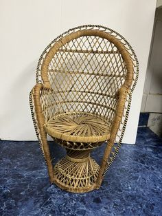 a wicker chair sitting on top of a blue floor