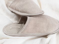 Slip into these cozy slippers and make the home being time even more pleasant. Made from natural fabrics, among which includes natural linen blend and leather which ensures quality and comfort. Made in a beige color. The leather sole ensures that the slippers are non-slip while the interior linen fabric makes them breathable.  These are the perfect indoor slippers, with the cozy upper part, lightweight insole with cushioning, designed to feel comfortable. A great choice for home use, while trave Cream Slip-on Slippers For Indoor Use, Beige Cushioned Slippers For Indoor Use, Cream Slip-on Indoor Slippers, Casual Beige Slippers With Soft Sole, Comfortable Beige Indoor Slippers, Beige Indoor Slippers, Comfortable Natural Slippers With Rubber Sole, Comfy Beige Slip-on Slippers, Beige Comfy Slip-on Slippers