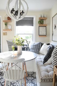 a dining room table with clear chairs around it