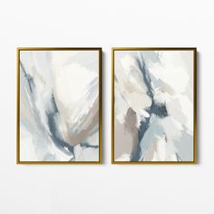 two framed paintings on the wall with white and blue paint in gold trimmings