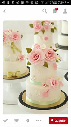 three tiered wedding cakes with pink flowers on them