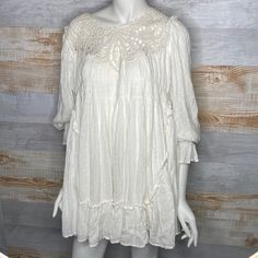 Free People Mini Crotchet Bohemian Dress Size Medium Cream Brand New Without Tags. Never Worn. Excellent Condition, No Flaws A Perfectly Boho Look Starts With The Free People Priscilla White Crochet Mini Dress! This Ultra-Breezy Sundress Begins With Ruffled Straps, A Beautiful Detailed Crochet Neckline, And A Relaxed Bodice, Decorated With Crochet Lace And Pierced Eyelet Embroidery. Trapeze-Style Waist Drops Into A Warm Weather Friendly Mini Hem. Fully Lined. Shell: 100% Rayon. Lining: 100% Visc Spring Boho Dress With Lace Patchwork, Mini Bohemian Boho Dress For Brunch, Bohemian Mini Boho Dress For Brunch, Bohemian Mini Length Boho Dress For Brunch, Mini Length Bohemian Dress For Brunch, Bohemian Daywear Dress With Lace Trim, Bohemian Lace Trim Dress For Daywear, Flowy Cotton Mini Dress With Lace Trim, Bohemian Mini Dress With Lace Patchwork For Vacation