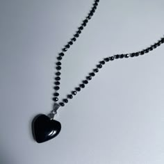 "𝘽𝙇𝘼𝘾𝙆 𝙃𝙀𝘼𝙍𝙏 𝙉𝙀𝘾𝙆𝙇𝘼𝘾𝙀 * handmade in Los Angeles * Acrylic Black Heart + Beads * Stainless Steel Chain + hardware * tarnish-proof + strong * 16\"-18\" adjustable length Please allow 1-5 days before shipment | Each piece is made by hand Message me with any questions you have, I am happy to help ☺ x Madz Cold Shoulder LA @coldshoulder__" Black Heart Necklace, Black Necklaces, Black Beaded Necklace, Black Heart Necklace Aesthetic, Black Heart Beaded Necklace, Black Heart Beads Pendant Necklace, Goth Heart Necklace, Dark Academia Jewelry, Handmade Black Heart-shaped Beaded Necklace