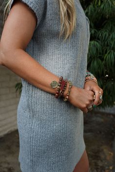 So effortless and cool the Maysen Bracelet Set is the perfect boho accessory to add a little sparkle and boho to your favorite outfits! It will become your go-to accessory! Multiple bracelet layers with distressed metal for added style Multi-color and mutli-size stones and beads with elastic stretch Cute charms and pendants including so PRETTY druse geode pendant and bronze coin Pair with: Evermore Seamless Lace Racerback Bralette, Lightwave Overalls and Seeing Stars Bracelet Set. *Due to lighti Boho Essentials, Bralette Outfit, Multiple Bracelets, Boho Accessories, Star Bracelet, Layered Bracelets, Cute Charms, Trending Accessories, Bracelet Set