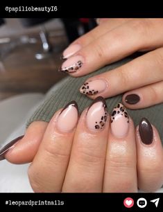 Almond-shaped nails in earthy tones bring out the ultimate chic vibes. A perfect blend of soft nude polish with dark brown leopard print and tips, this look balances elegance with a bit of sass. Almond Nails Designs Cheetah, Almond Dark Nails, Almond Leopard Nails, Nude Brown Nail Designs, Brown Leopard Nails, Dark Brown Nails Designs, Leapord Nails Acrylic, Leopard French Tip, Leopard Print Nail Designs