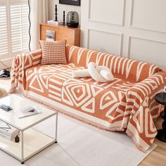 an orange and white couch in a living room