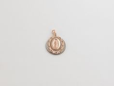 "Fabulous 14k Solid Rose Gold Virgin Mary Miraculous Pendant! Metal Purity: 14k Gold , Stamped , Not plated Length: 3/4\" or 20 mm long Width: Almost 5/8\" or 15 mm wide Weight: 1.50 grams Complementary Gift Box There is a prayer around Mary which says: O Mary conceived without sin pray for us who have recourse to thee. This pendant is about the same size as a dime. Images may be enlarged to show detail and the item may look larger than it appears in person.In order to reduce buyer remorse and r Rose Gold Medallion Jewelry With Polished Finish, Rose Gold Medallion Jewelry With Charms, Elegant Round Miraculous Medal Jewelry, Elegant Miraculous Medal Jewelry, Oval Rose Gold Charms Jewelry, Elegant Miraculous Medal Round Pendant Jewelry, Hallmarked 14k Rose Gold Jewelry, 14k Hallmarked Rose Gold Jewelry, Miraculous Medal