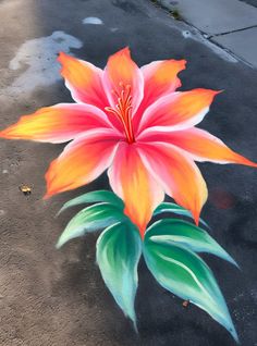 a painting of a flower on the ground painted with acrylic paint and colored pencils