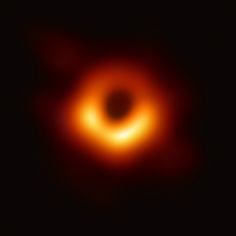 a black hole is shown in the dark sky